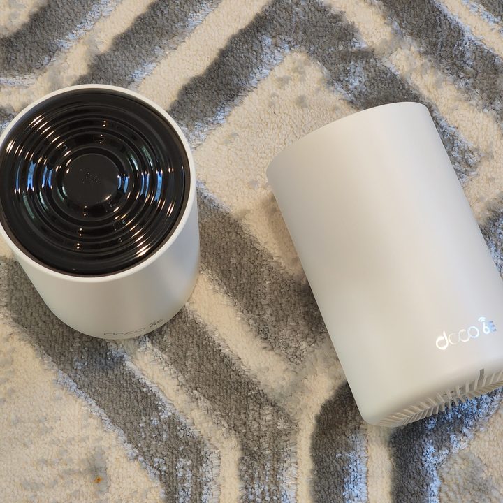 The TP-Link Deco XE75 top and front.