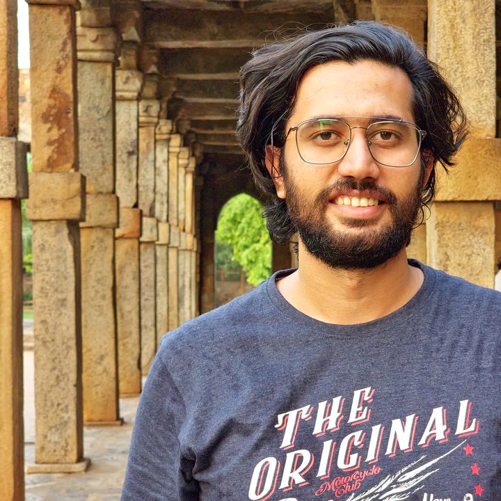 Unedited portrait shot of a man near the Indian monument Qutub Minar shot on the Samsung Galaxy S22 Ultra in RAW.