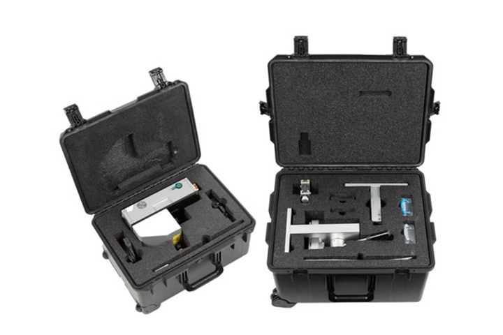 Two large black cases open showing a variety of repair tools in Apple's Self-Service Repair Kit