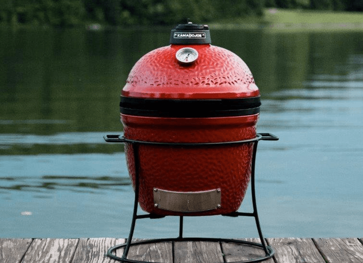 KAMADO JOE JOE JR grill on stand outside