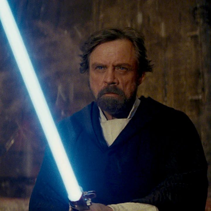 Luke Skywalker with a blue lightsaber at the climax of The Last Jedi.