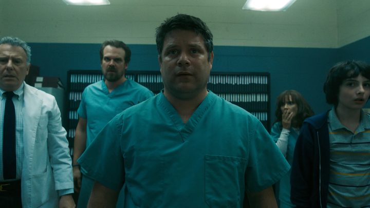 The cast of Stranger Things in the lab.