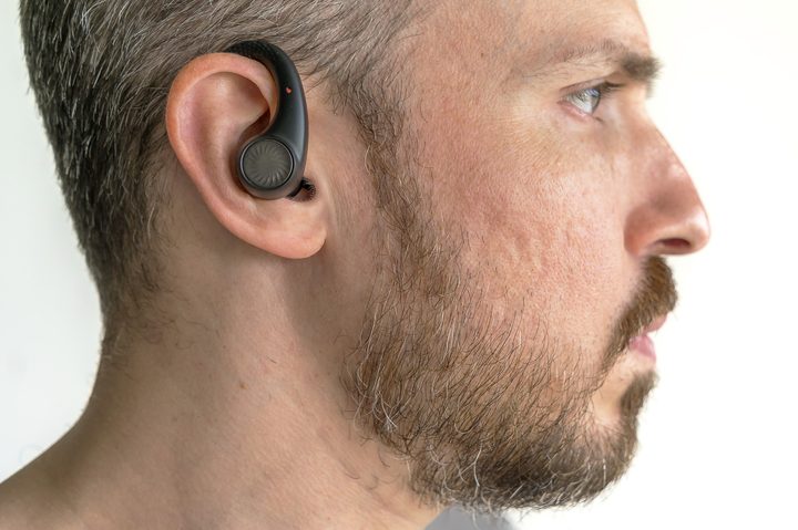 Wearing the Tribit MoveBuds H1.