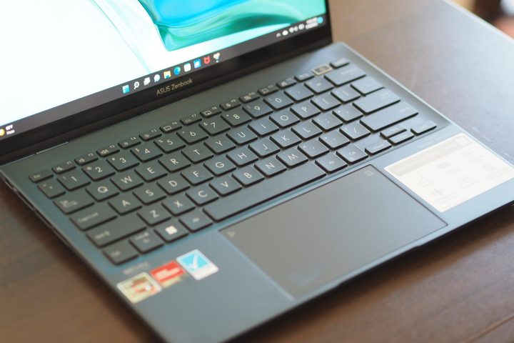 Asus Zenbook S 13 OLED UM5302 front view showing keyboard and touchpad.