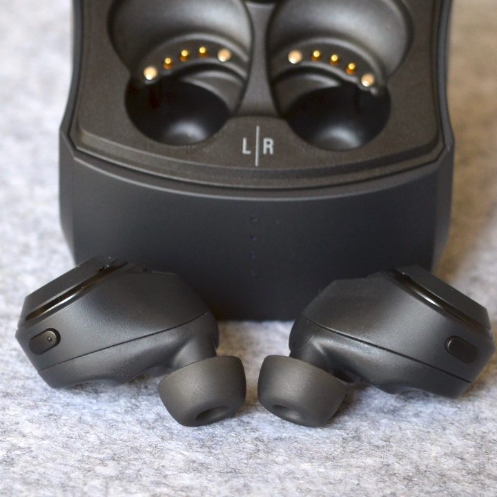 Audio-Technica ATH-CKS50TW wireless earbuds seen in front of their case.