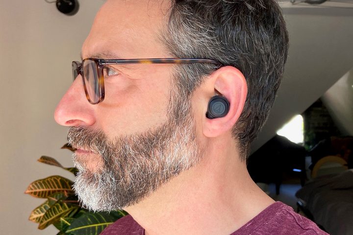Man wearing Audio-Technica ATH-CKS50TW wireless earbuds.
