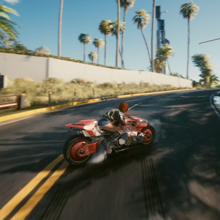 A motorcycle drifting around a turn.