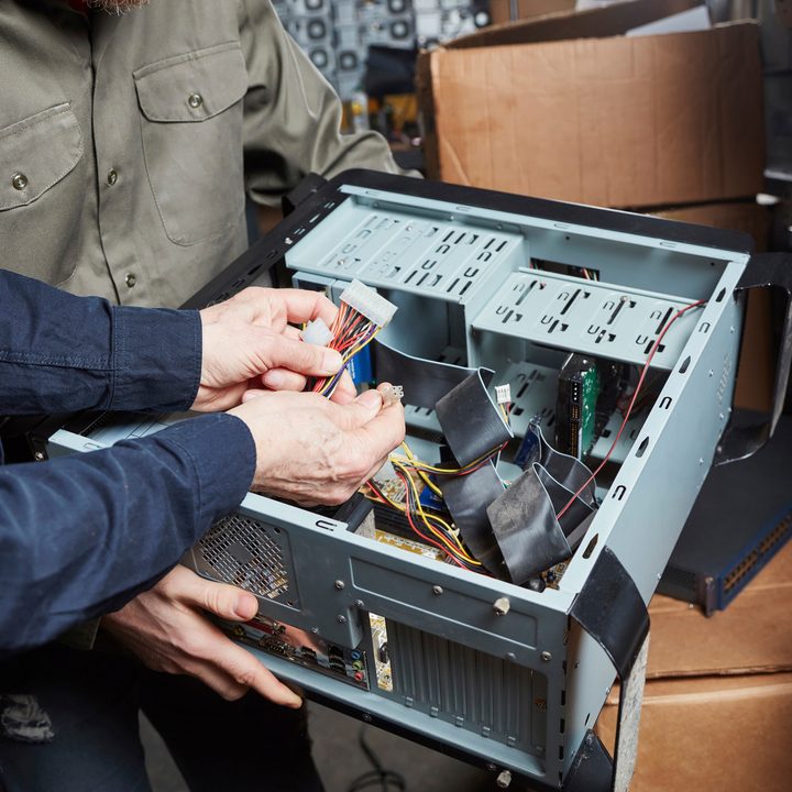 An individual building a desktop PC.