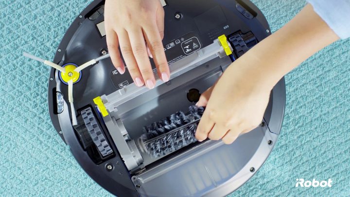 Cleaning a Roomba.