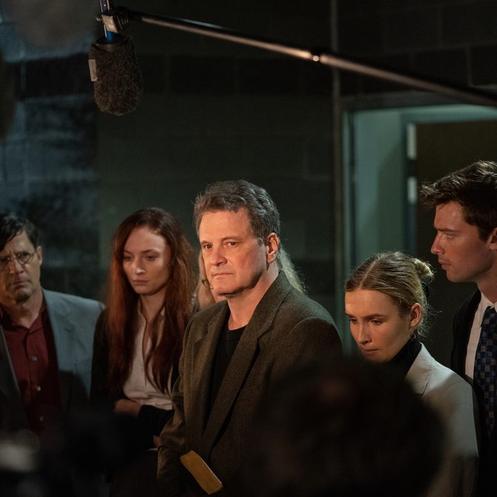 Colin Firth stands in front of a group of reporters in The Staircase.