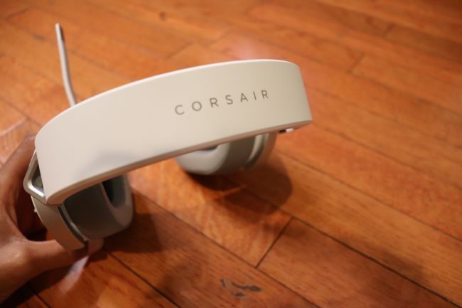 The Corsair HS65 headset with its microphone open.