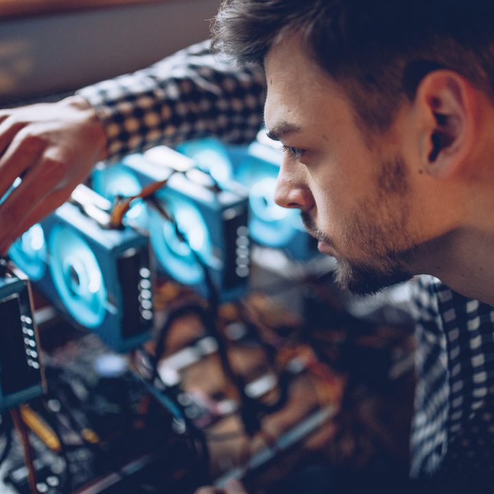 A programmer preparing a crypto currency mining rig