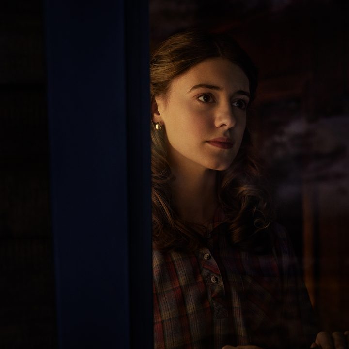 Daisy Edgar-Jones looks out a window in Under the Banner of Heaven.