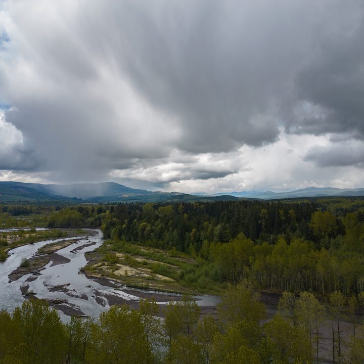A river with storms overhead.