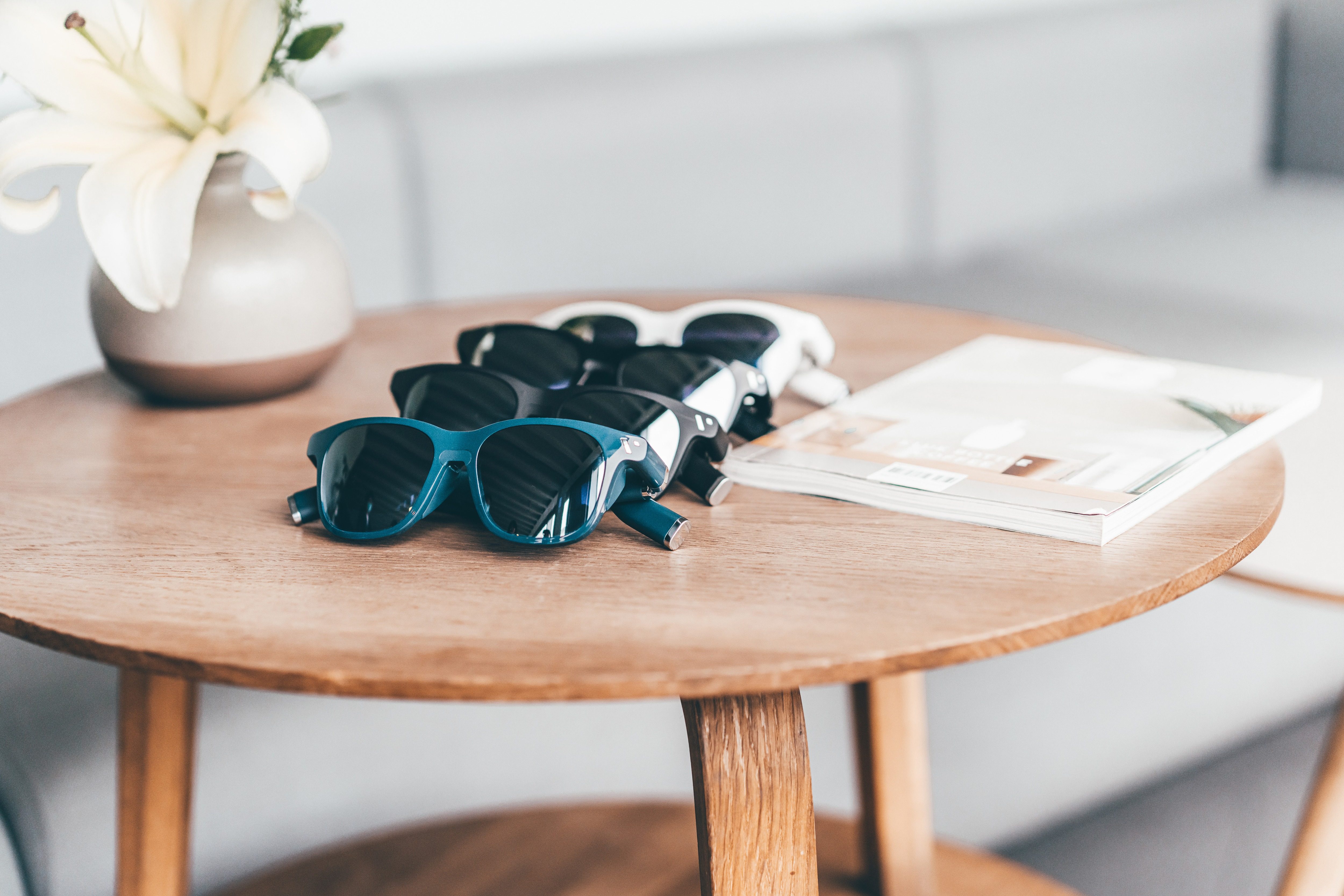 Multiple Viture One glasses on a desk.