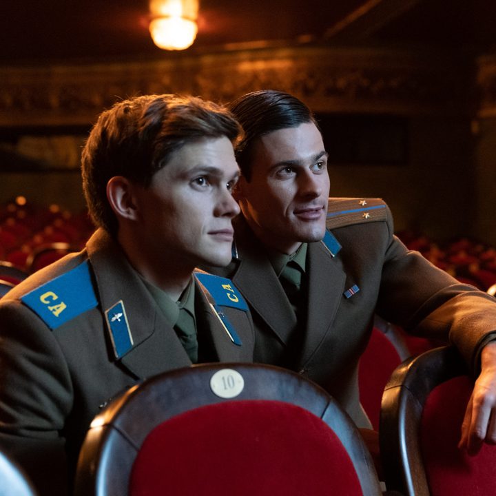 Roman and Serget sit in a theater in Firebird.
