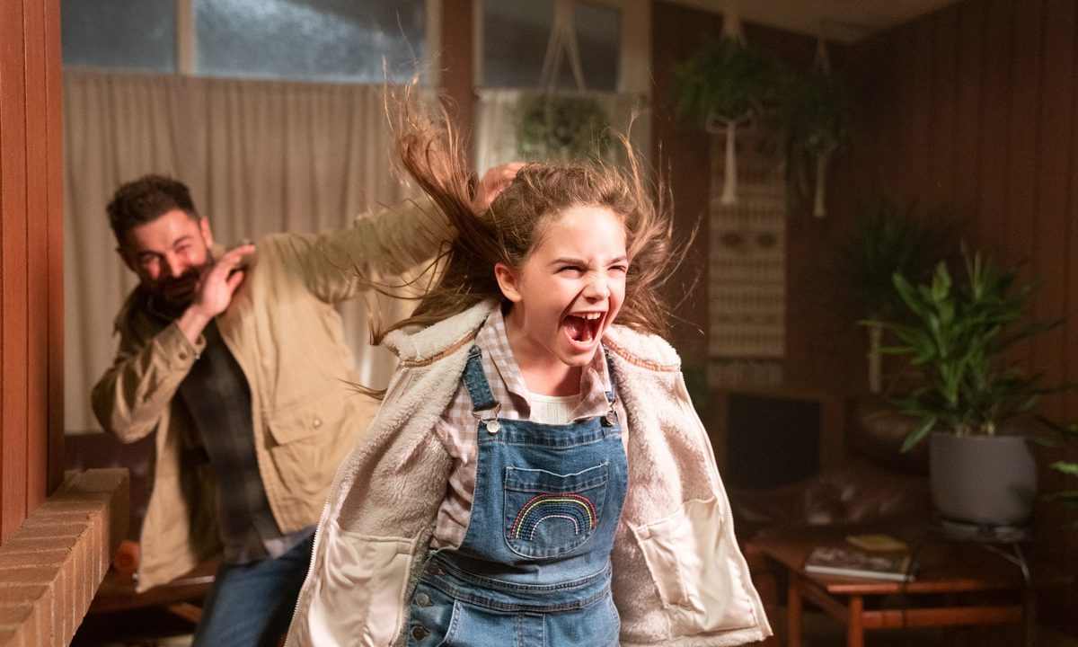 Ryan Kiera Armstrong screams at the camera in a scene from Firestarter.