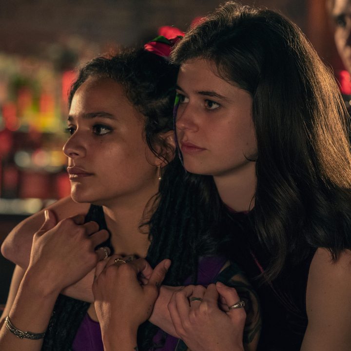 Frances stands with an arm wrapped around Bobbi in Conversations with Friends.