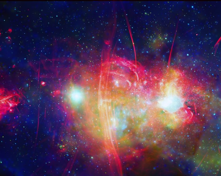 The central region of our galaxy, the Milky Way, contains an exotic collection of objects, including a supermassive black hole weighing about 4 million times the mass of the Sun, clouds of gas at temperatures of millions of degrees, neutron stars and white dwarf stars tearing material from companion stars, and beautiful tendrils of radio emission. This new composite image shows Chandra data (green and blue) combined with radio data (red) from the MeerKAT telescope in South Africa.