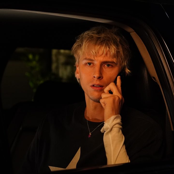 Machine Gun Kelly on his phone in a still from Good Mourning.