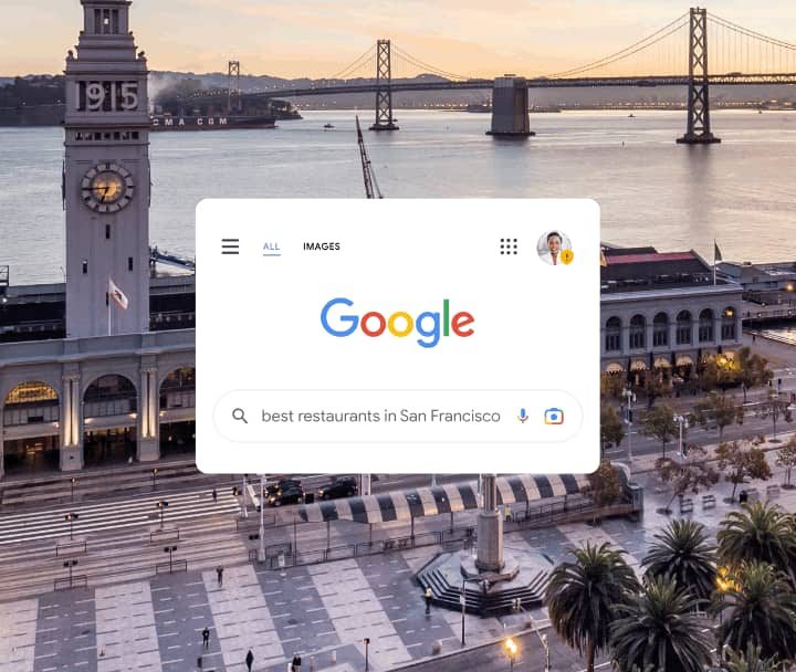 Google Search with San Francisco wallpaper showing Google Account Safety Status icon over profile picture.