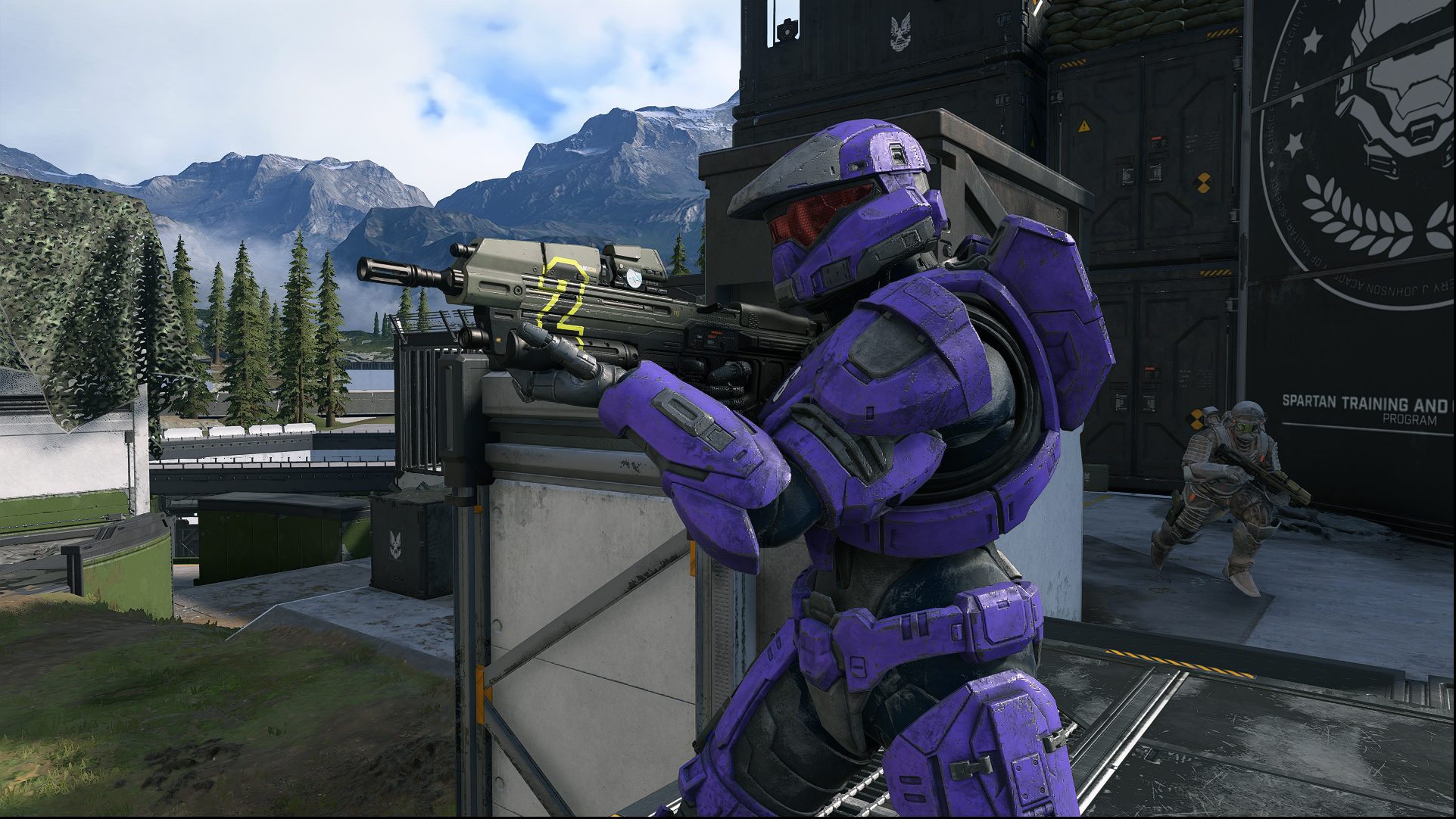 A Spartan aims their assault rifle in Halo Infinite.