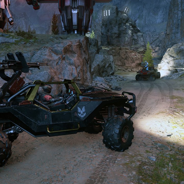 Two Spartans in a Warthog in Halo Infinite.