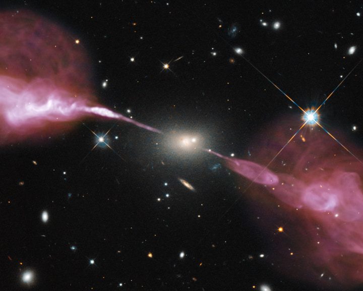 Spectacular jets powered by the gravitational energy of a supermassive black hole in the core of the elliptical galaxy Hercules A as imaged by Hubble Space Telescope's Wide Field Camera 3 and the Karl G. Jansky Very Large Array (VLA) radio telescope in New Mexico.