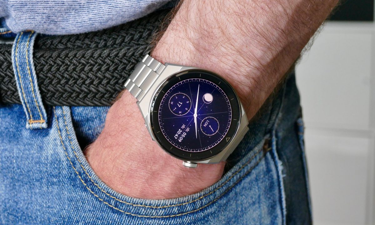 Huawei Watch GT 3 Pro on man's wrist in pocket.