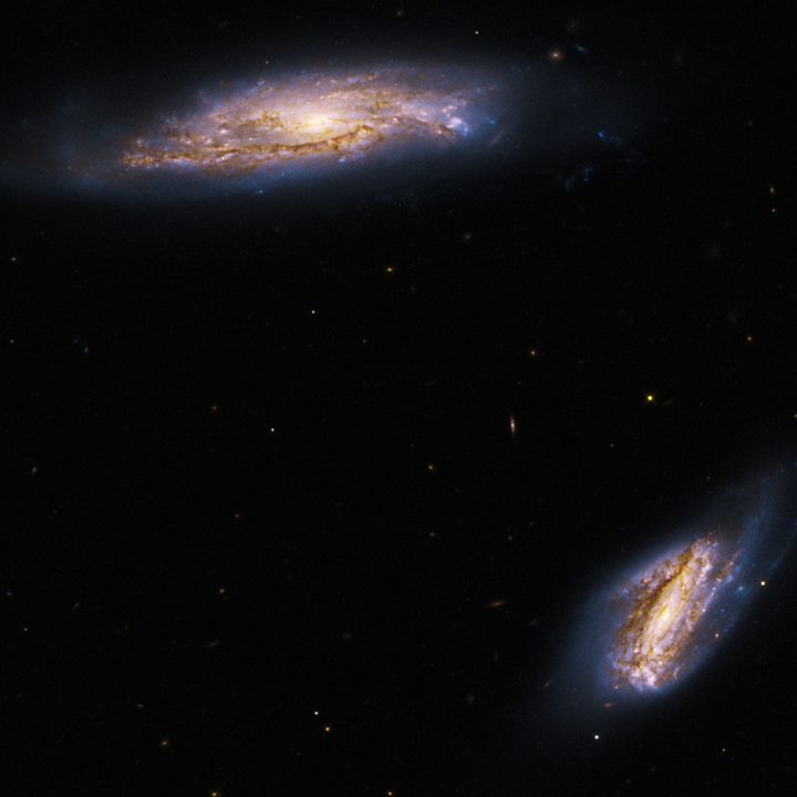 This new image from NASA’s Hubble Space Telescope looks at two spiral galaxies, collectively known as Arp 303.