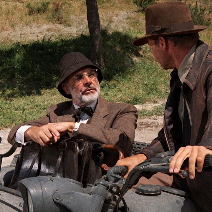 Sean Connery and Harrison ford share a motorcycle.