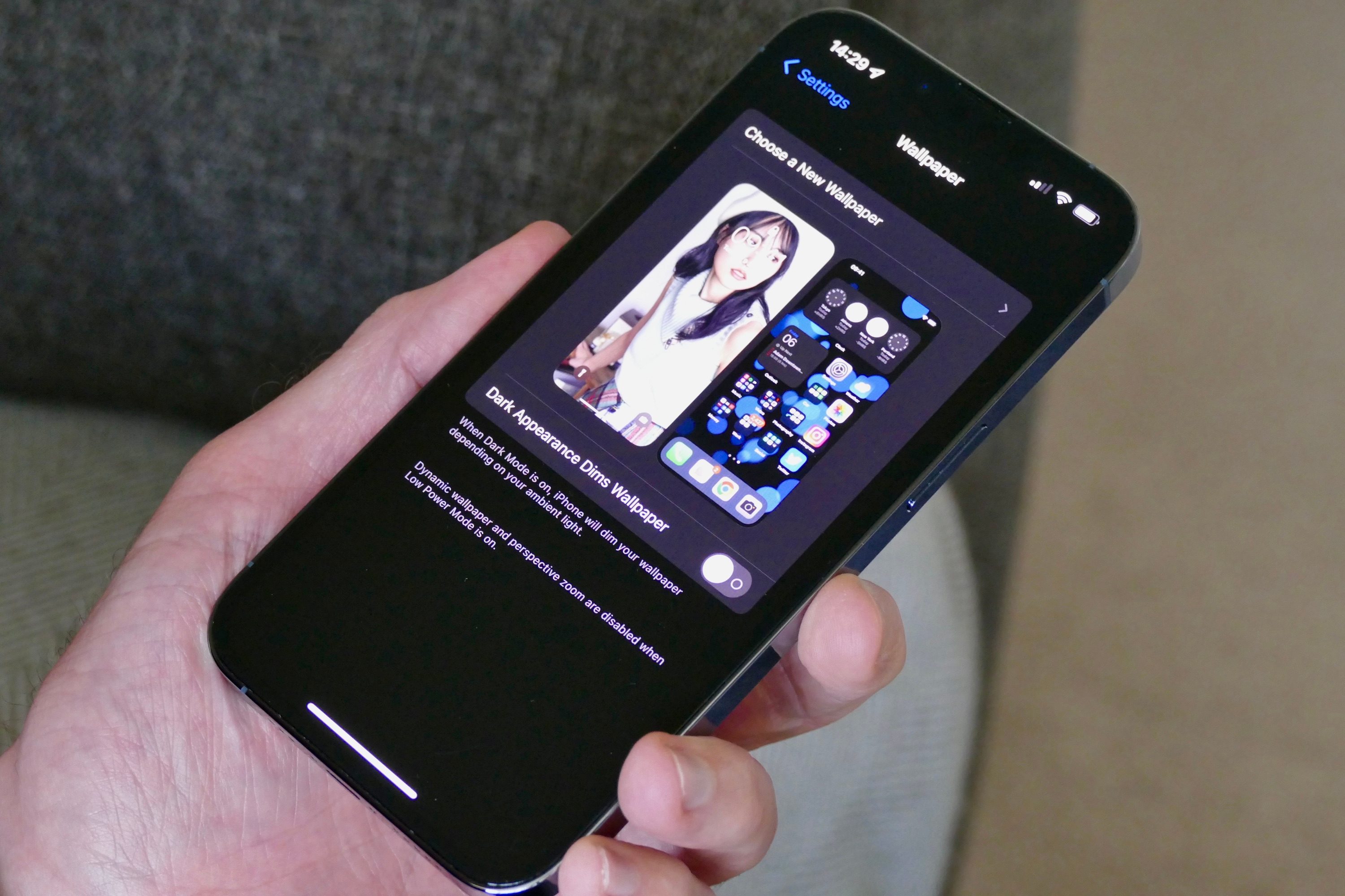 Choosing iOS wallpaper on an iPhone 13 Pro.