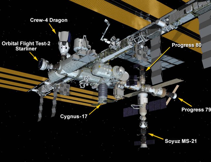 Six spaceships are parked at the space station.