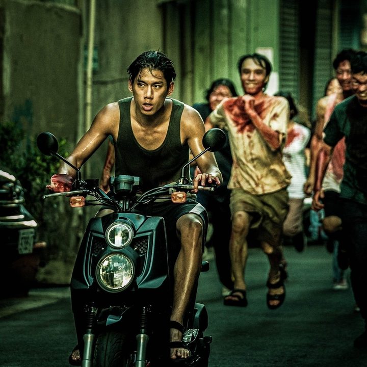 Jim drives away on his motorcycle from a group of crazed zombies in The Sadness.