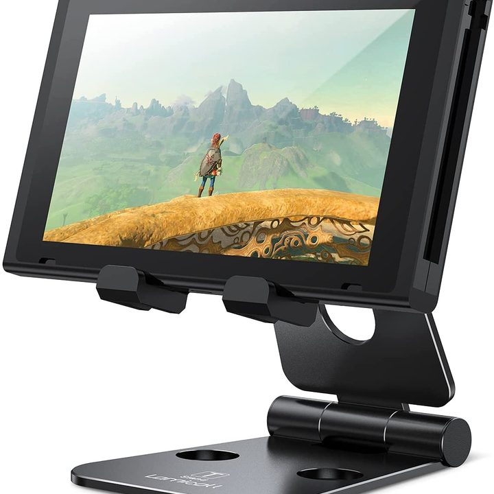 A Switch running zelda on a stand.