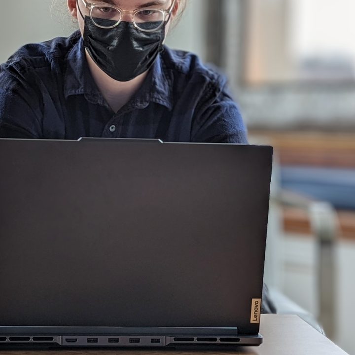 Someone typing on the Lenovo Legion Slim 7i.