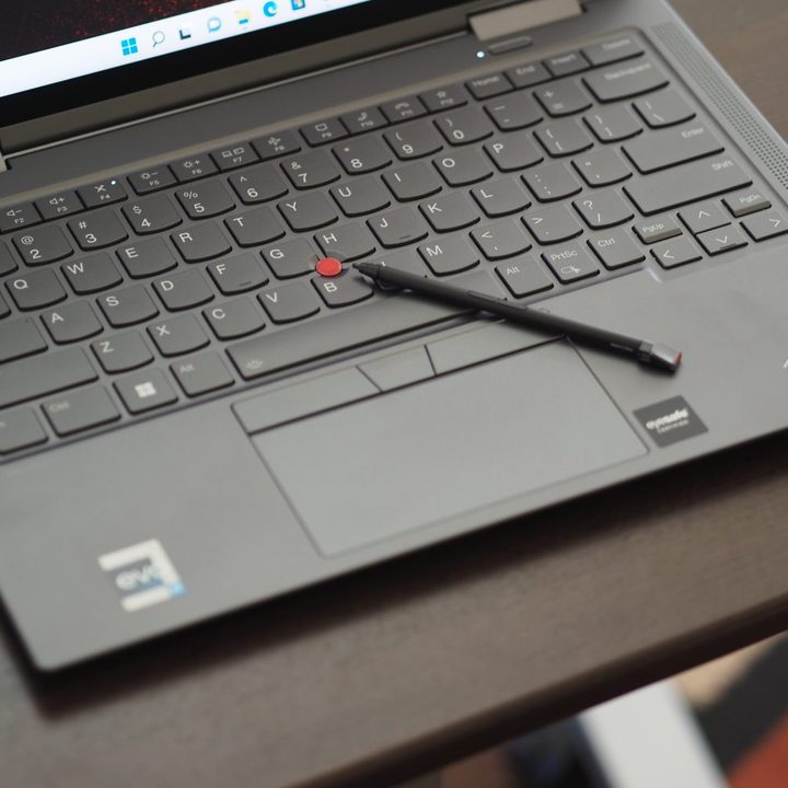 Lenovo ThinkPad X1 Yoga Gen 7 top down view showing keyboard, touchpad, and pen.