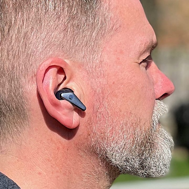 Wireless earbud in right ear.