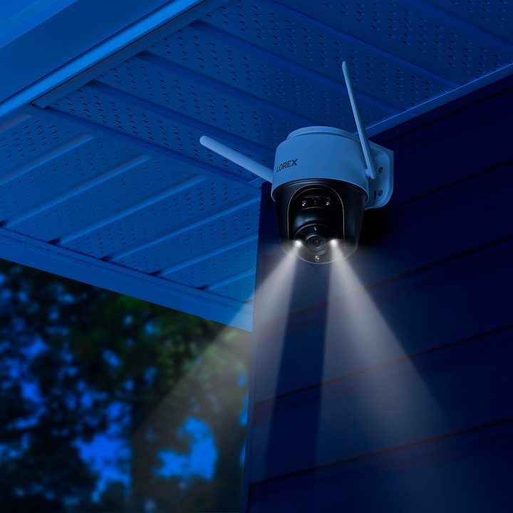 Lorex 2K Pan-Tilt WiFi Outdoor Security Camera at night with color vision.