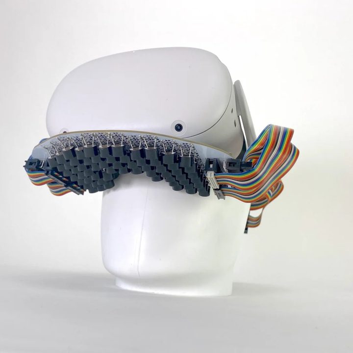 VR headset with mouth haptics device.