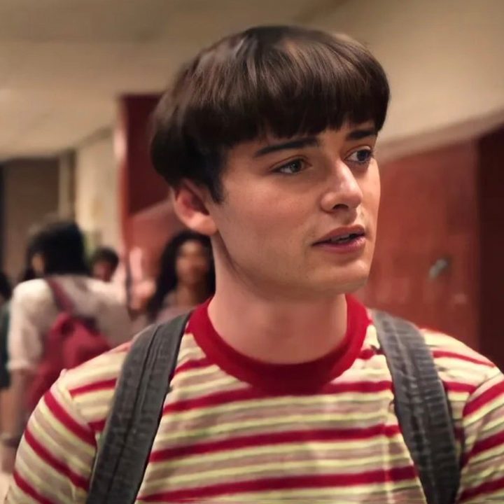 Will Byers walks down a school hallway in season 4 of Stranger Things.