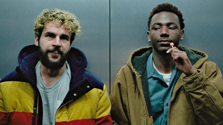 Two men ride an elevator in On the Count of Three.