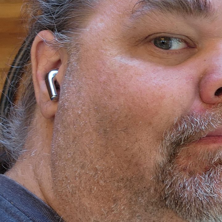 A man wears the OnePlus Buds Pro.