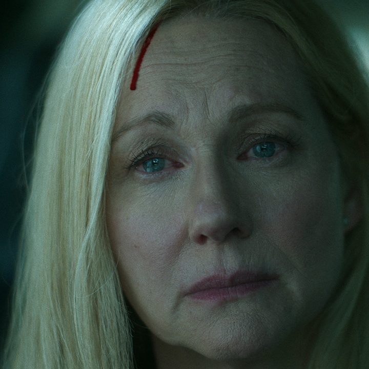 Wendy with a cut on her forehead staring into space in a scene from Ozark.