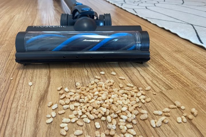 The Proscenic P11 vacuuming cereal.