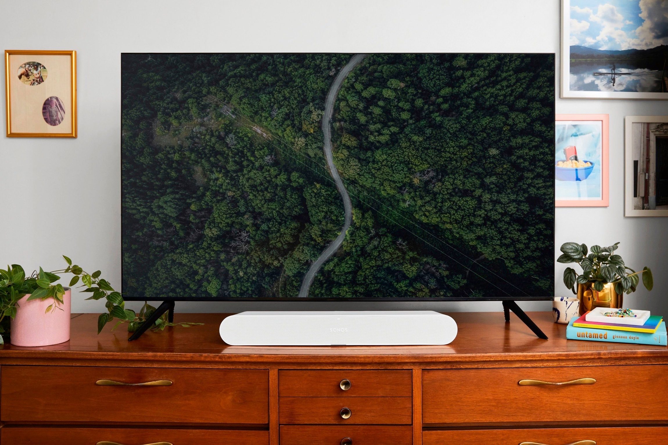 A leaked publicity photo of a new Sonos soundbar in white seen under a TV.