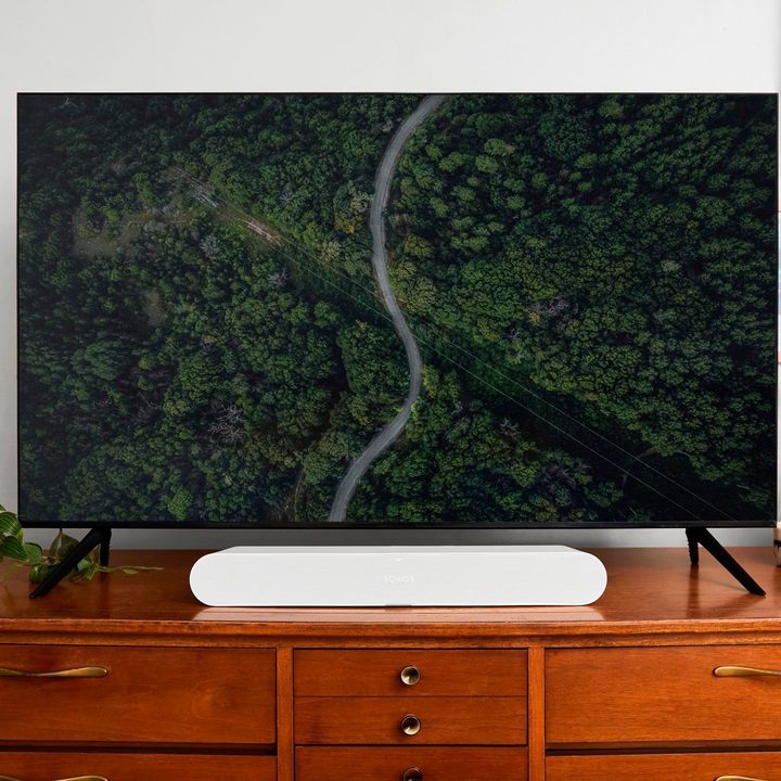 A leaked publicity photo of a new Sonos soundbar in white seen under a TV.