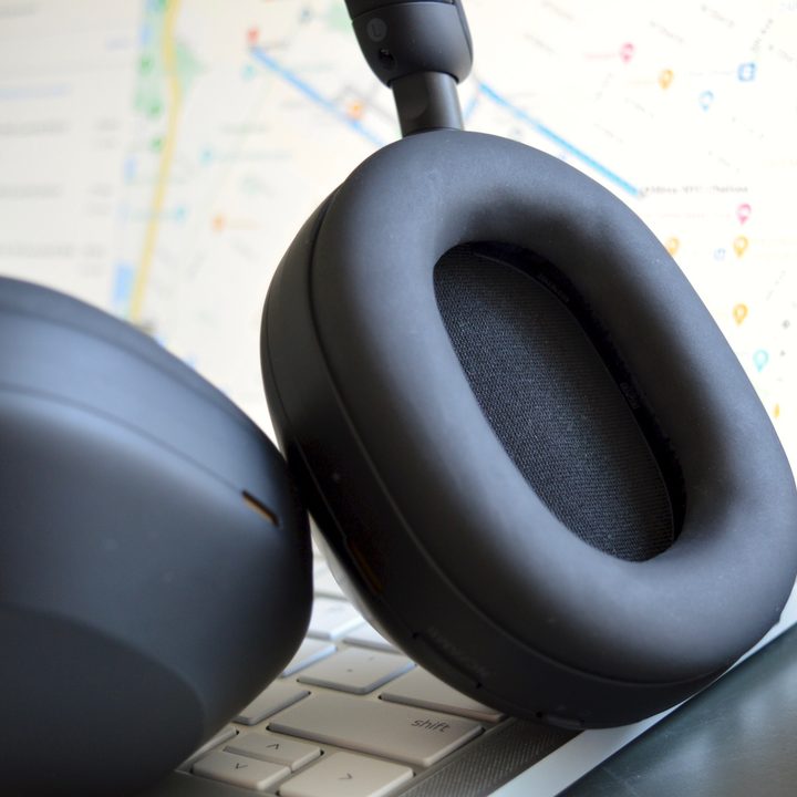 Close-up of earcup on Sony WH-1000XM5 wireless headphones.