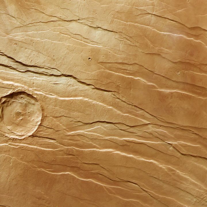This image from ESA’s Mars Express shows part of a large fault system on Mars known as Tantalus Fossae. This image comprises data gathered by Mars Express’ High Resolution Stereo Camera (HRSC) on 19 July 2021. It was created using data from the nadir channel, the field of view aligned perpendicular to the surface of Mars, and the colour channels of the HRSC. It is a ‘true colour’ image, reflecting what would be seen by the human eye if looking at this region of Mars.