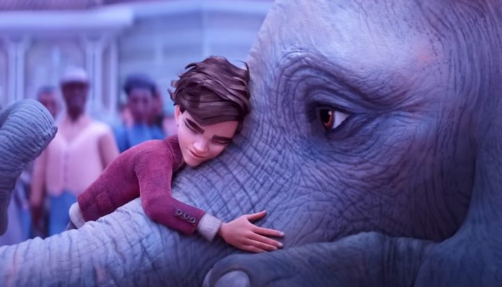 A boy hugs an elephant in The Magician's Elephant.